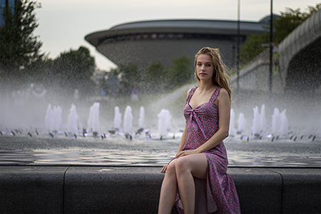 Pretty blonde girl infront of well at Spodek, Katowice.