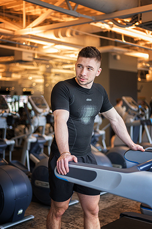 A young athletic man in the gym.