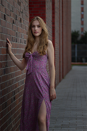 Fashion shooting with Wiktoria wearing a pink long dress.