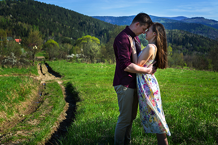 A couple huging in country side.