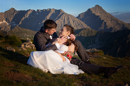 A romantic moment for a wedding couple in the mountains, late at evening.